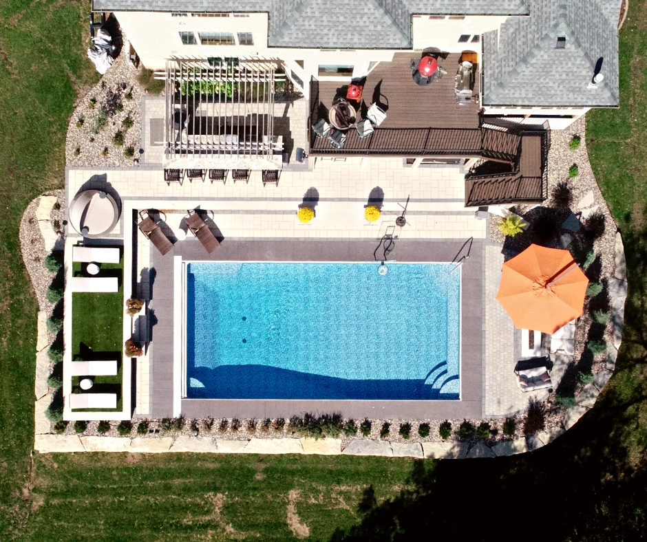 aerial view of home with deck and pool