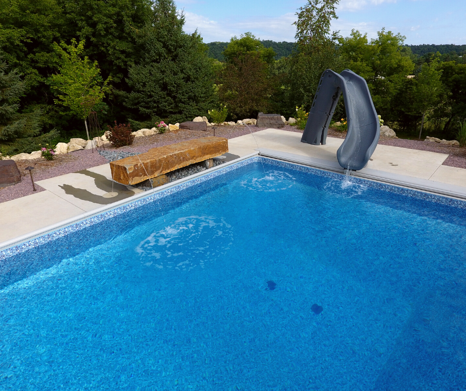 pool with slide and rock bench