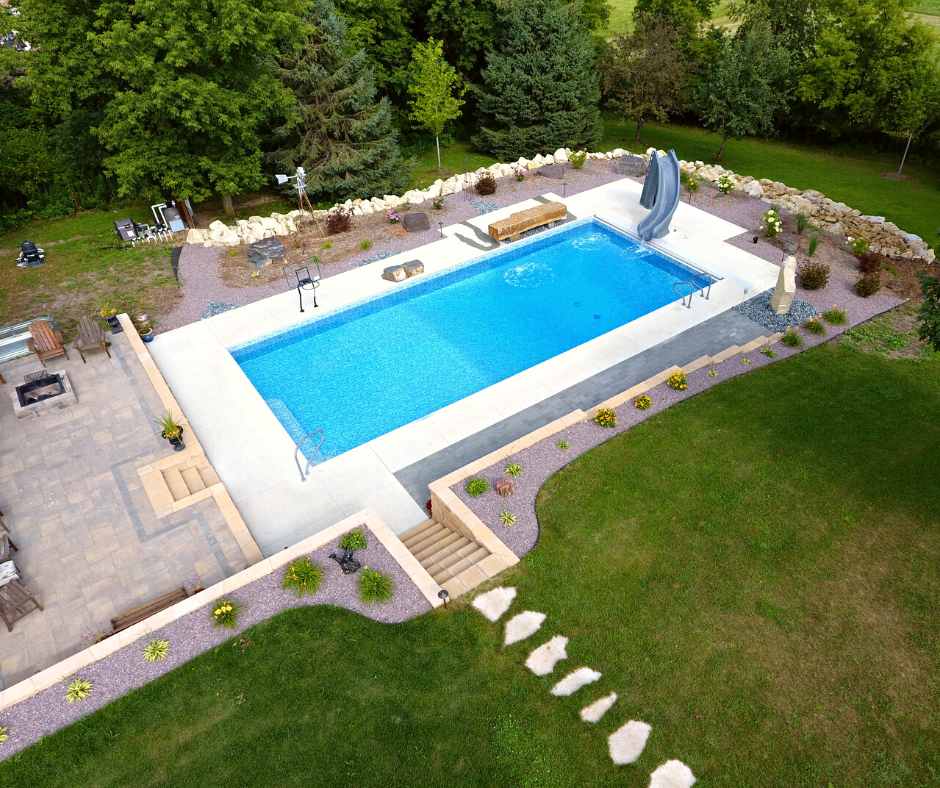 pool with slide and landscaping