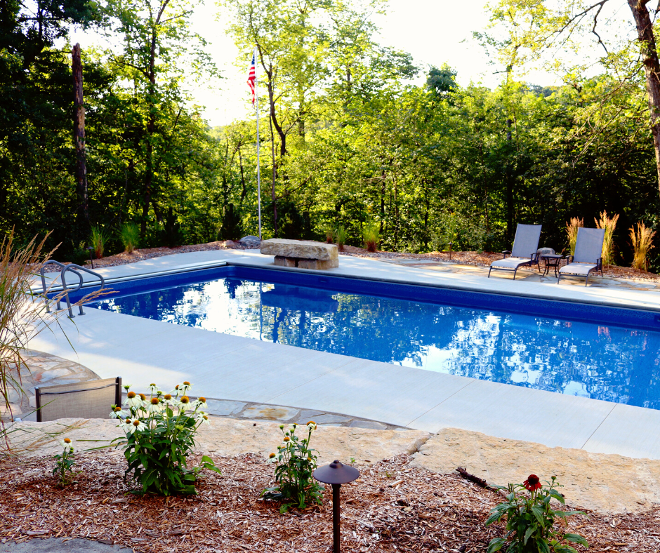 blue pool in wooded area