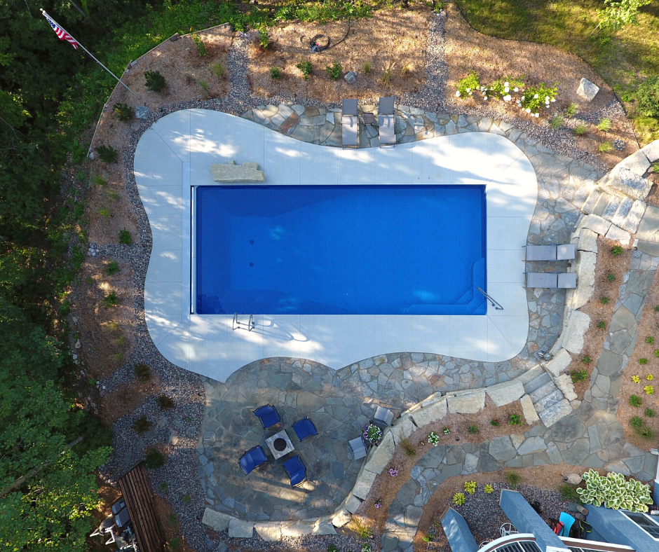 aerial view of rectangular pool with rock landscaping